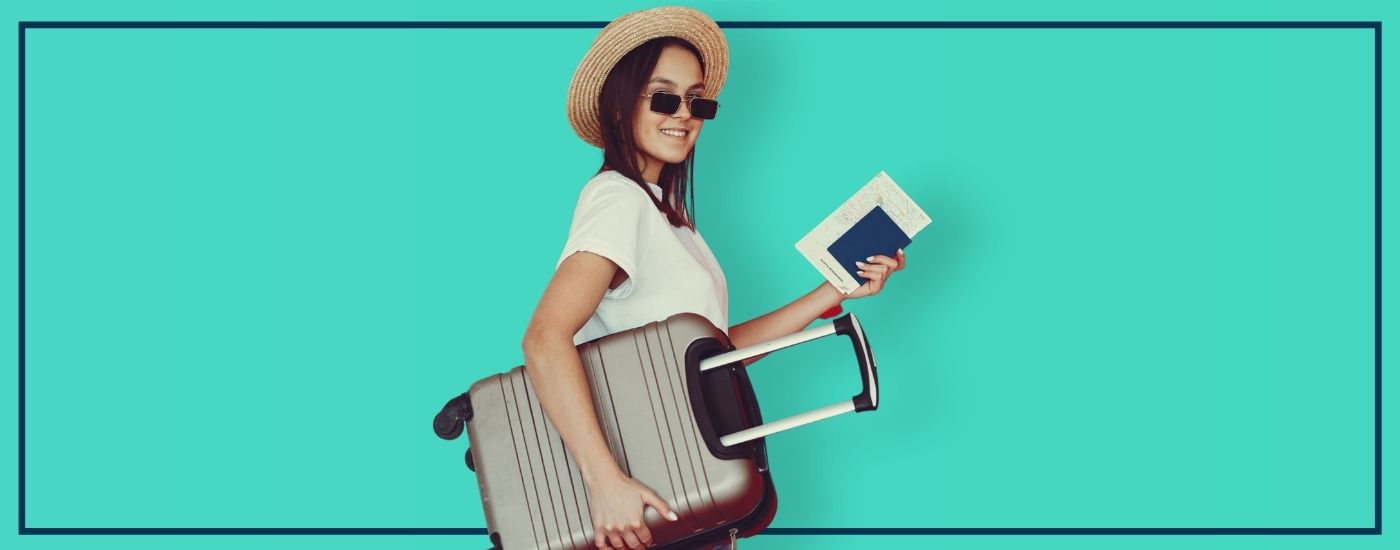 Girl with luggage and passport ready to travel